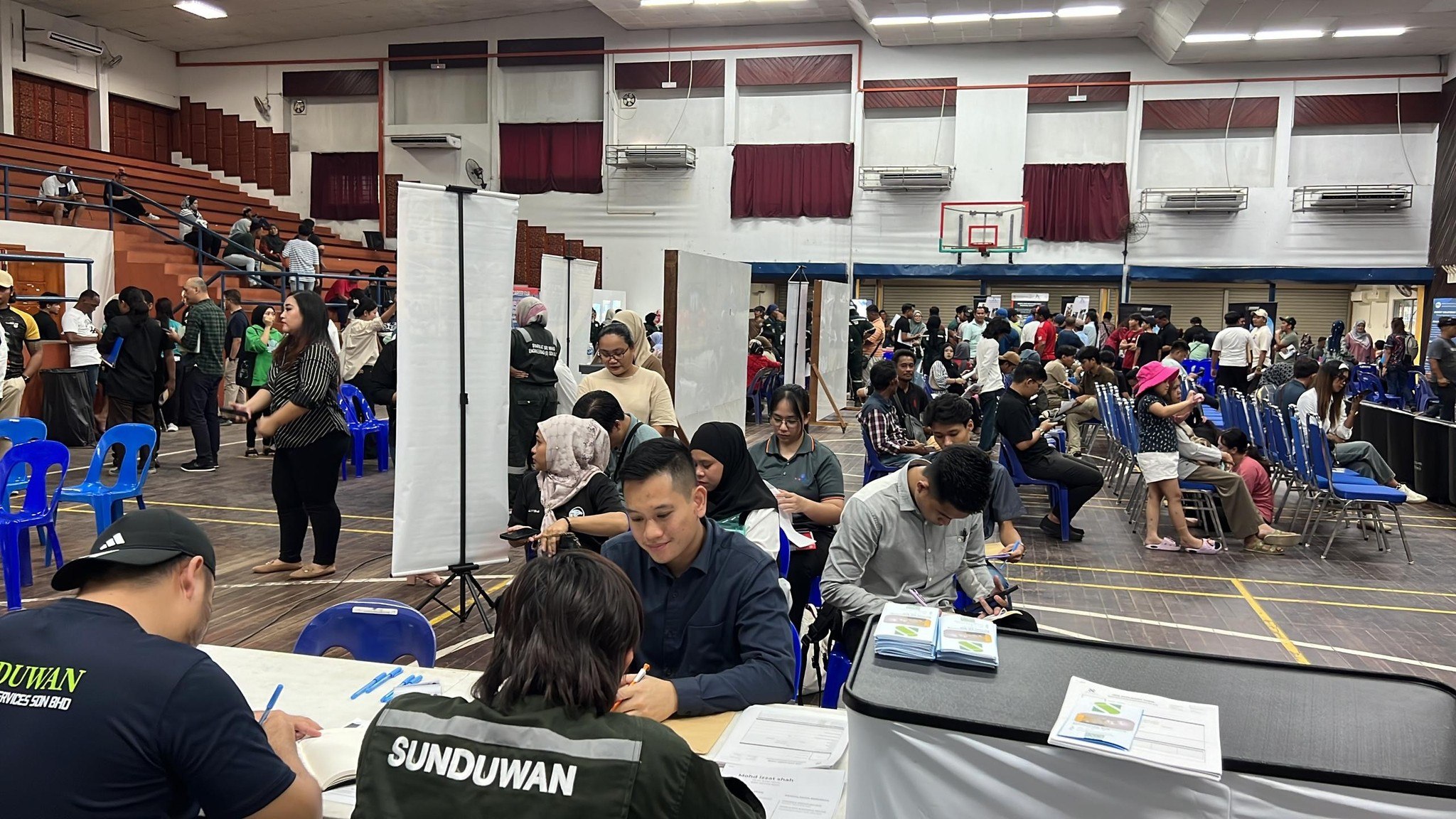 Team members engaging with potential candidates